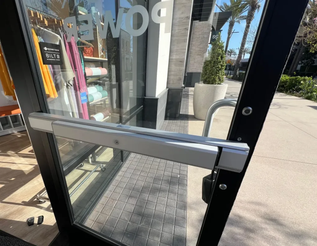 Adams Rite MS1850S deadlock mechanism exposed inside narrow stile aluminum storefront door frame