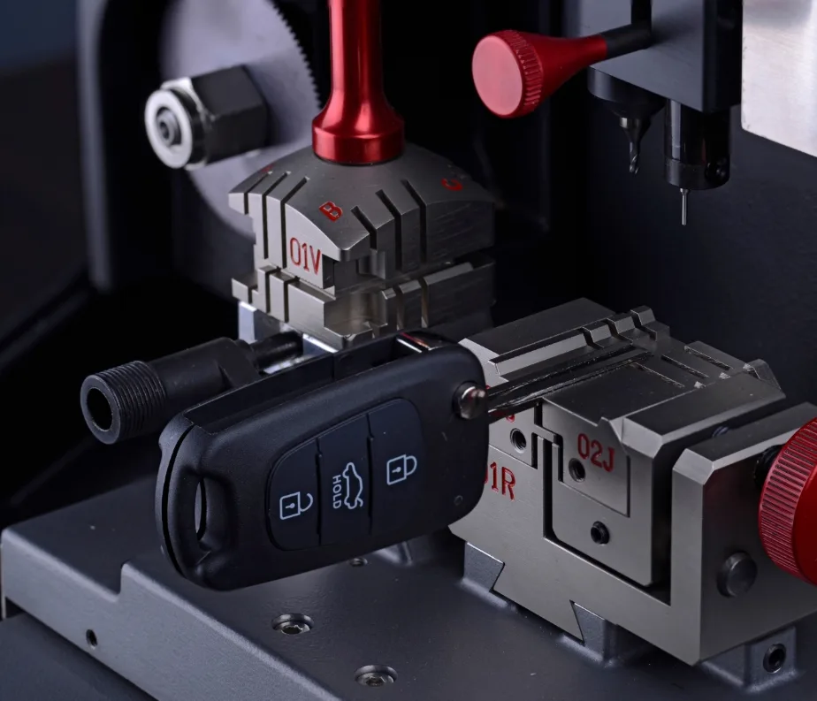 Automotive locksmith programming a transponder car key in West Melbourne, FL
