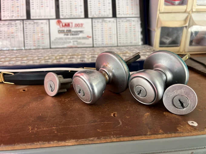 Locksmith rekeying a residential door lock cylinder in West Melbourne, FL