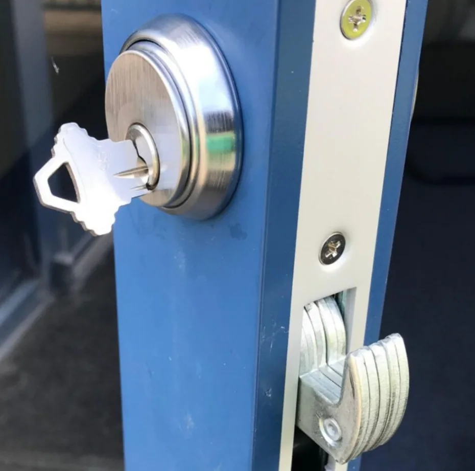 Locksmith rekeying a residential door lock cylinder in Palm Bay, FL