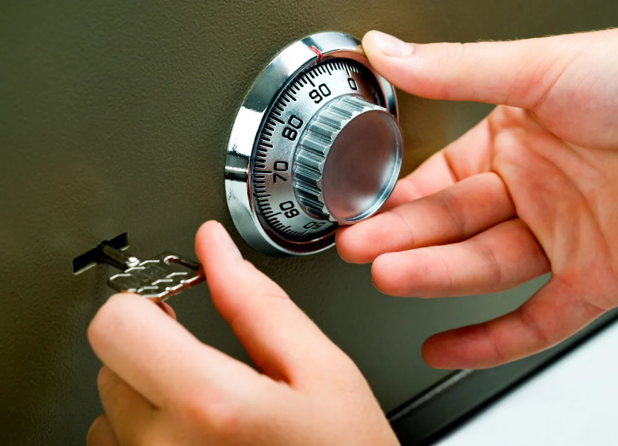 Locksmith working on a commercial safe combination lock in Grant-Valkaria, FL