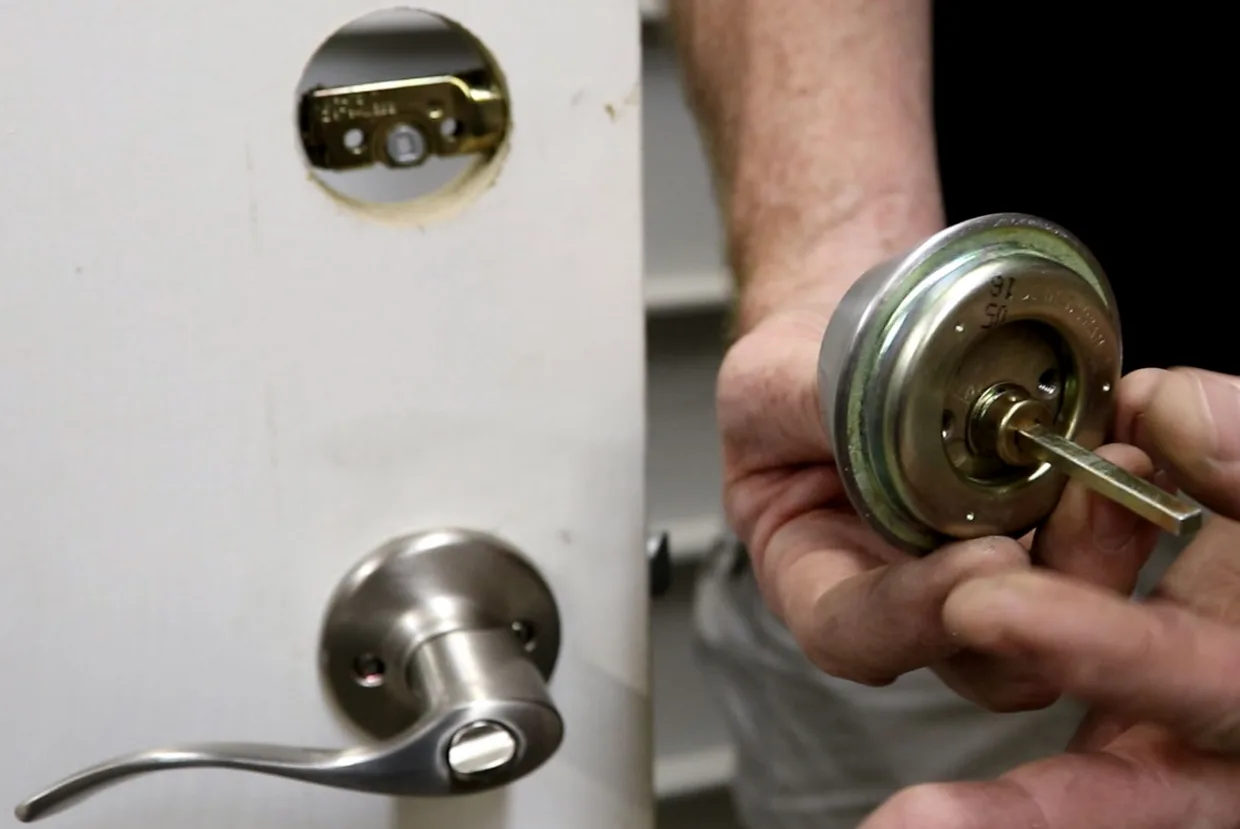 Licensed locksmith installing a deadbolt lock